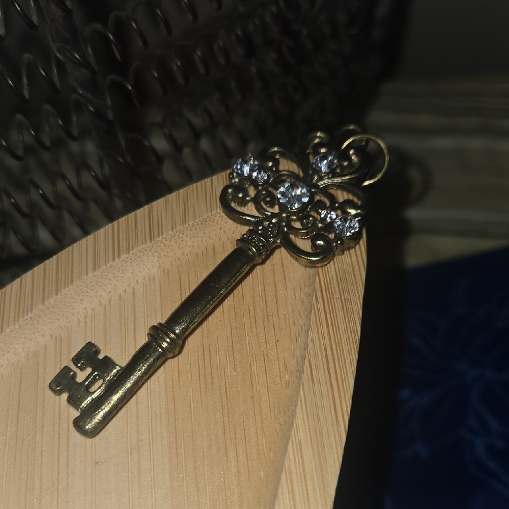 Elegant Gold Key with Crystal Accents